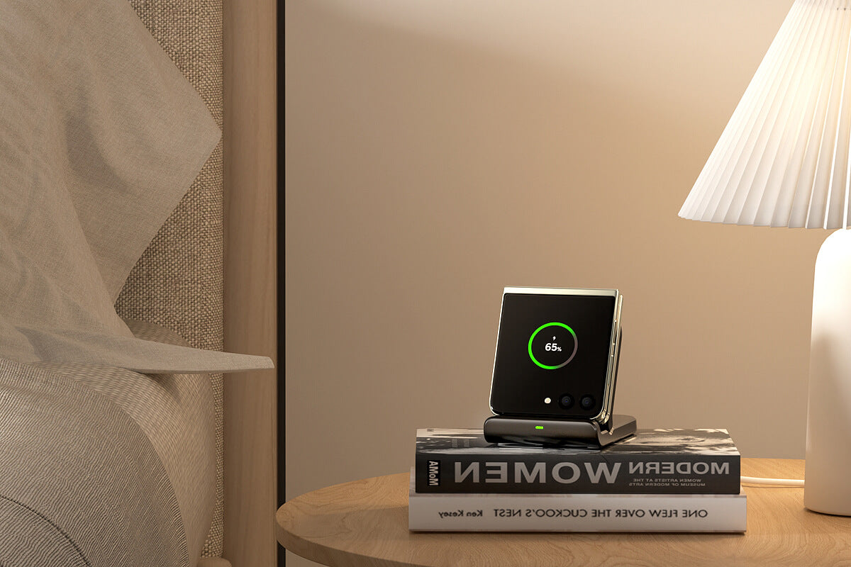 a samsung galaxy Z Flip phone on two books